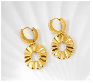 Macro view of gold-plated stainless steel earrings with textured ruffled metal plates