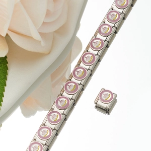 Detail of Italian charm bracelet link with pink enamel cake pattern in stainless steel