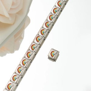 Detail of modular stainless steel charm bracelet with rainbow and cloud enamel patterns