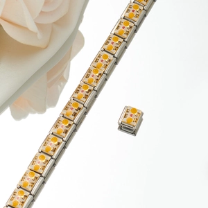 Detail of Italian charm bracelet links featuring Big Sis and Lil Sis heart designs