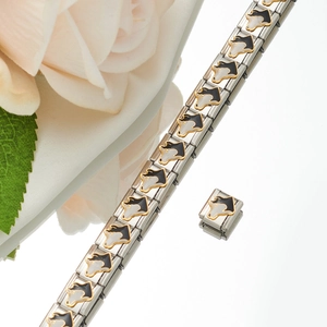 Close-up of an Italian charm bracelet with a black and white enamel bull charm and a rose