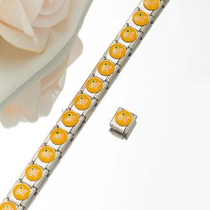 Macro shot of Italian charm bracelet showing yellow emoji links on brushed stainless steel