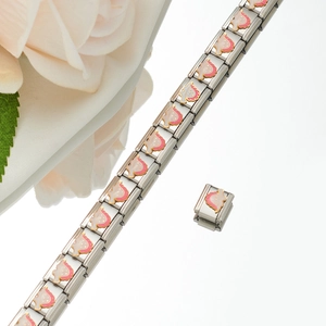 Detailed close-up of stainless steel strawberry charm modular bracelet links