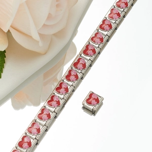 Detail of Italian modular stainless steel bracelet with pink paw print heart charms