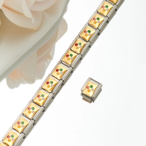 Detail of modular stainless steel charm link with colorful enamel flower and gold inlay
