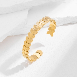 Elegant gold leaf motif open cuff bracelet in stainless steel with carved textures