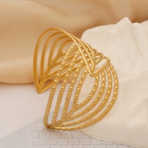 Golden titanium steel wide open bangle with heart cutouts and vintage beaded texture
