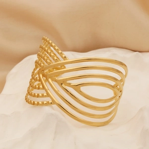Detail view of gold boho hollow wide cuff bracelet with intricate bead textures