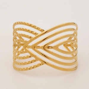 Detailed view of golden multi-layer cuff bracelet with beaded lines and hollow geometric design