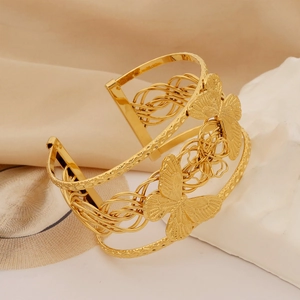 Golden titanium steel wide open bangle with hollow weave pattern and 3D butterfly design