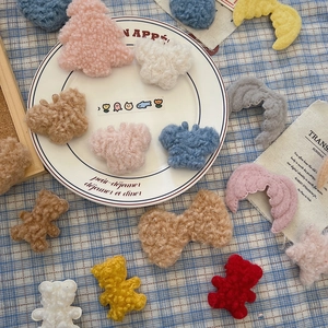 Macro detail of soft teddy plush DIY Christmas accessories in various shapes and colors