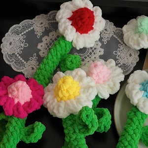 Handmade knitted chamomile flower bouquet with colorful chenille yarn and green stems