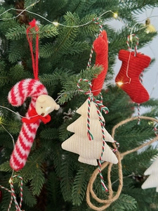 Christmas tree fabric ornaments including striped candy cane bear and knitted tree charms