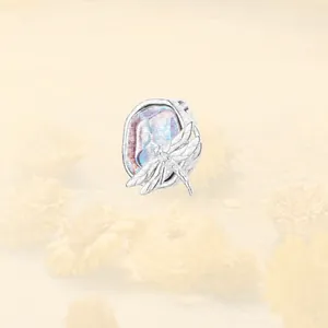 Close-up of S925 sterling silver dragonfly bead charm with iridescent opal-like finish