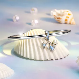 Bracciale in argento 925 con ciondoli tartaruga, stella marina e perla su conchiglie