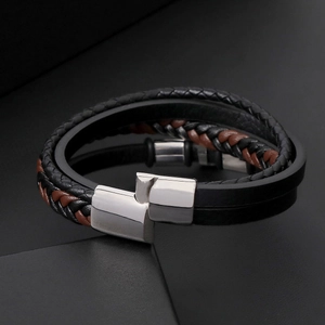 Close-up of multilayer leather bracelet with yellow tiger eye and stainless steel clasp