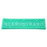 Detailed view of mint green silicone lace mold with vintage European vine scroll relief