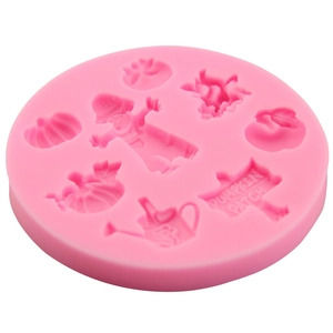 Pink silicone mold featuring pumpkin patch shapes for DIY fondant and chocolate baking