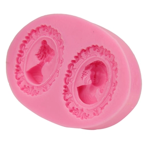 Pink silicone mold featuring two Victorian lady cameo portraits for fondant and cake baking