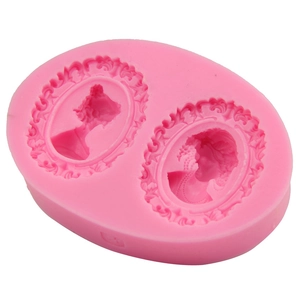 Pink silicone fondant mold featuring dual Victorian cameo portraits and floral frames
