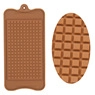 Detail of dark brown silicone chocolate molds with square and oval grid patterns