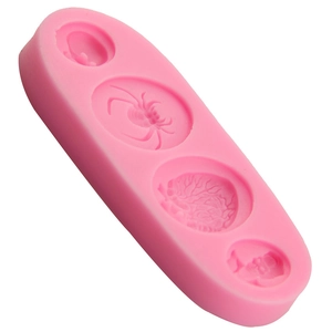 Pink silicone Halloween mold with skull, brain and spider shapes for fondant or chocolate