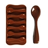 Detail of a 6-cavity spoon shaped silicone mold for chocolate and fondant cake decoration