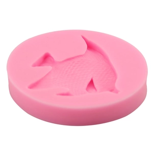 Pink silicone fondant mold featuring detailed tropical fish design for DIY cake decorating