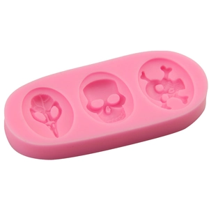 Pink silicone pirate skull fondant cake mold with three unique skull cavities for DIY baking