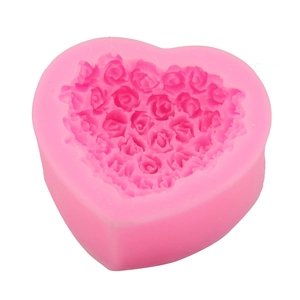 Pink heart-shaped silicone mold with detailed rose floral relief for DIY cake decorating