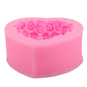 Pink heart-shaped silicone mold with detailed rose pattern for baking and DIY crafts