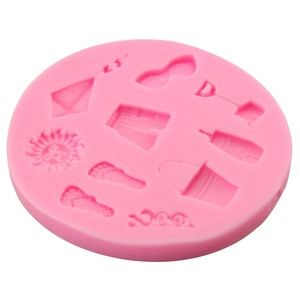 Pink silicone beach-themed fondant mold featuring sunglasses, bucket, and flip-flops