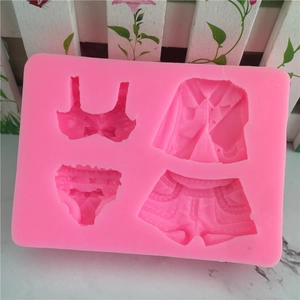 Pink silicone fondant mold featuring bikini and clothing shapes for DIY cake baking