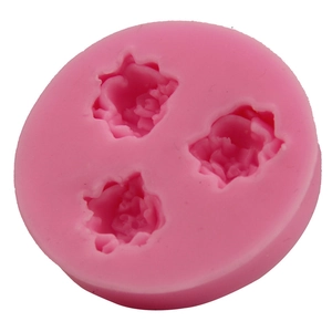 Pink circular silicone mold featuring three blooming rose cavities for DIY fondant baking