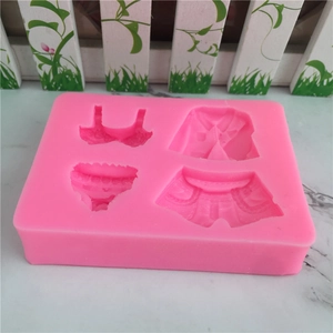 Pink silicone fondant mold featuring bikini and summer clothes shapes for cake decoration