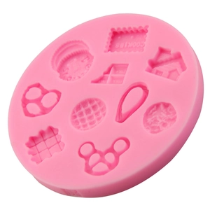 Pink silicone mold for cookies and fondant with house, heart, and waffle shapes