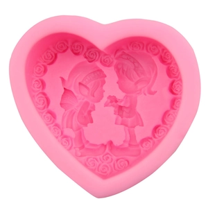 Pink heart-shaped silicone mold featuring embossed fairy and rose flower border