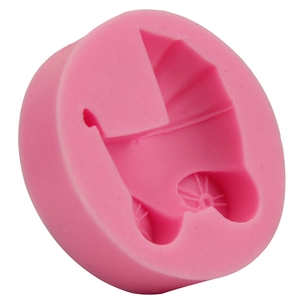 Pink food-grade silicone fondant mold featuring a detailed 3D baby stroller design