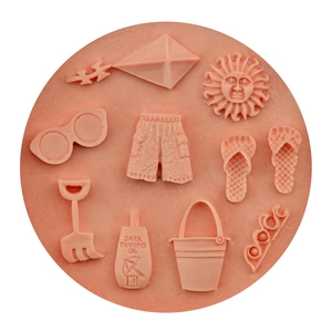 Pink silicone beach theme fondant mold featuring sunglasses sun and flip flops