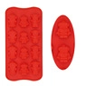 Detail showing two flexible red silicone molds with Christmas tree shaped cavities for baking