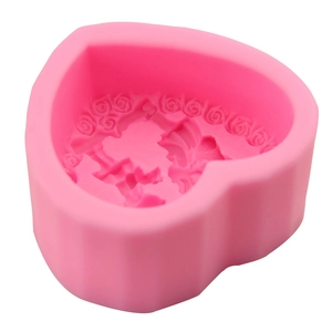 Pink heart-shaped silicone mold featuring an angel and rose relief for DIY cake decorating