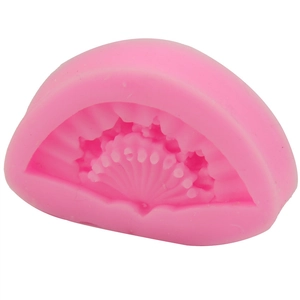 Pink fan-shaped silicone fondant mold with detailed textures for DIY cake decorating