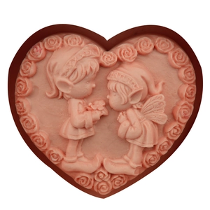 Pink heart-shaped silicone mold featuring fairy figures and 3D relief rose borders