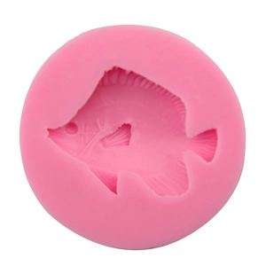 Pink round silicone mold featuring a detailed tropical butterfly fish shape for baking