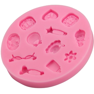 Pink silicone fondant mold with heart, star, and baby bottle shapes for DIY cake baking