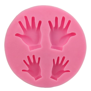 Round pink silicone mold with four palm-shaped cavities for DIY cake decorating and crafts