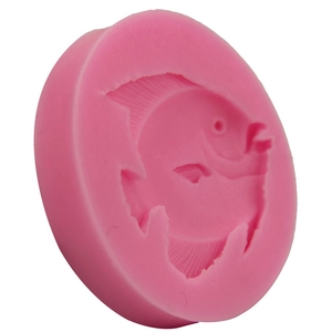 Pink silicone mold featuring an intricate tropical fish design for DIY cake decorating