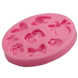 Pink silicone fondant mold with butterfly and baby clothes shapes for cake decorating