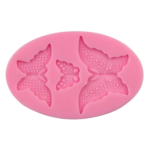 Pink silicone mold featuring three distinct lace butterfly designs for DIY fondant baking
