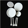 Detailed macro view of 8-piece white plastic fondant cake smoother tools on black surface